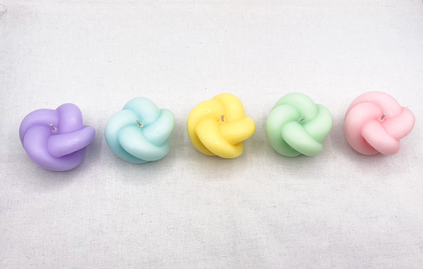 Pastel knot candles