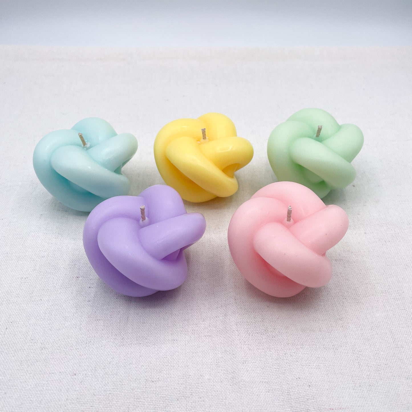 Pastel knot candles